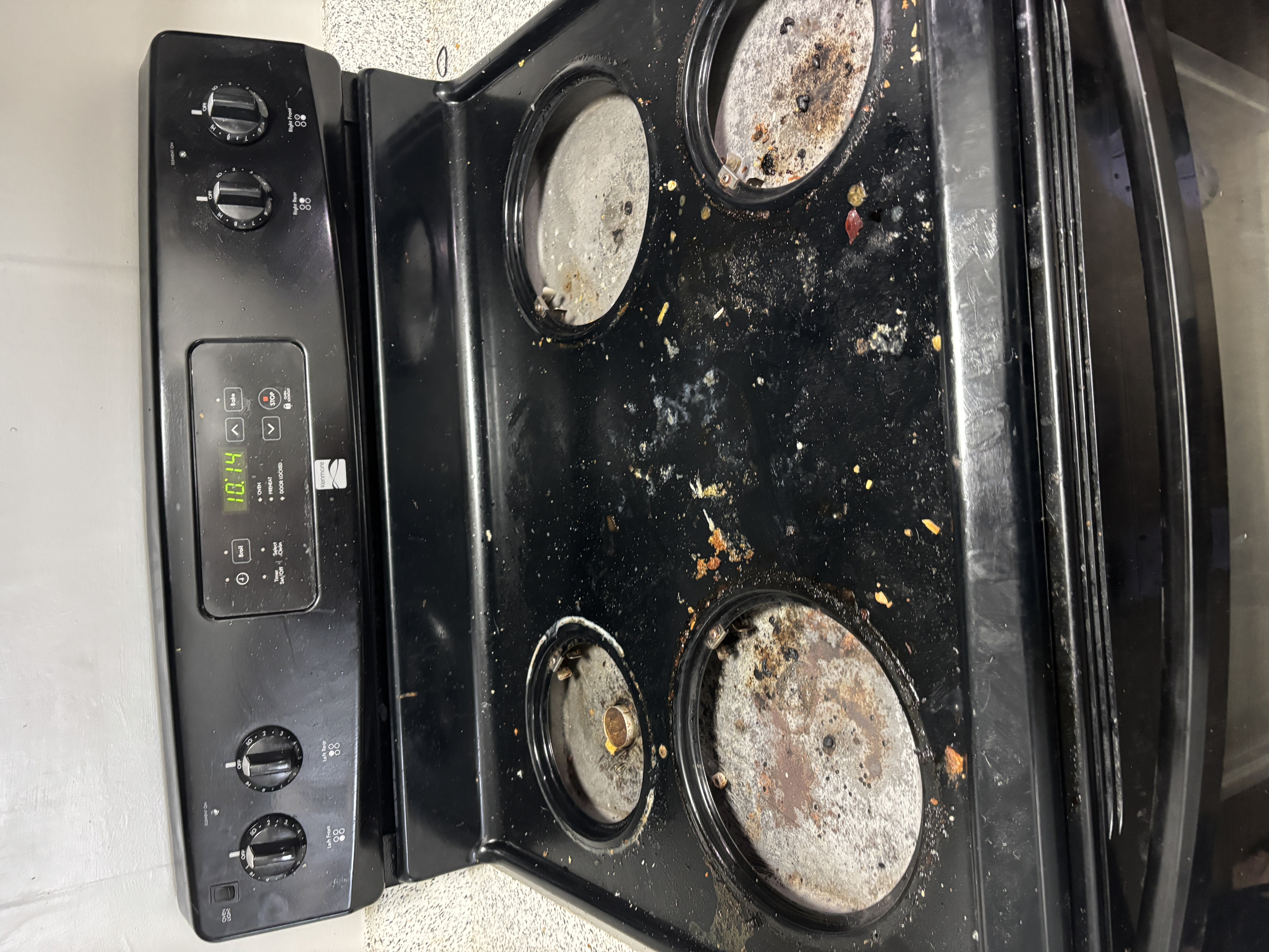 Dirty stove top before professional deep cleaning Tulsa Oklahoma - Vital Cleaning Services